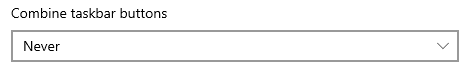 Настройка 'Объединять кнопки панели задач'. В выпадающем списке выберите 'Никогда'.
